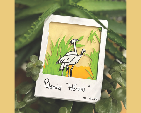 Composition papier représentant un couple de hérons
